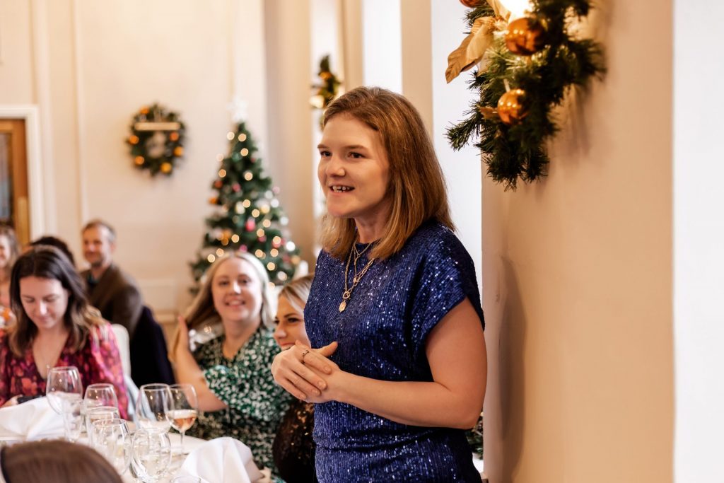 Candid photo during the wedding speeches at the Monsall Head Pub. Photo in colour.