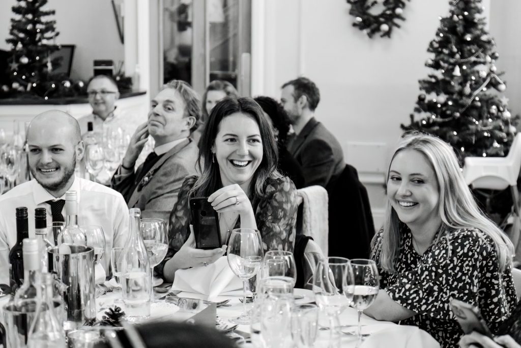 Candid photo during the wedding speeches at the Monsall Head Pub. Photo in black & white