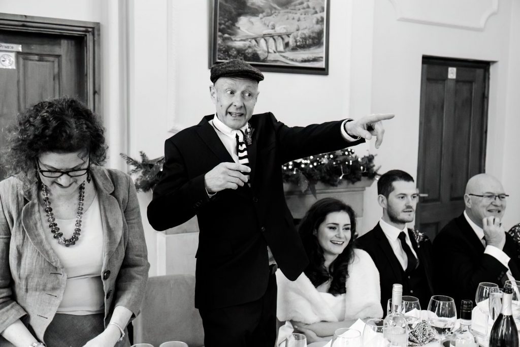 Candid photo during the wedding speeches at the Monsall Head Pub. Photo in black & white