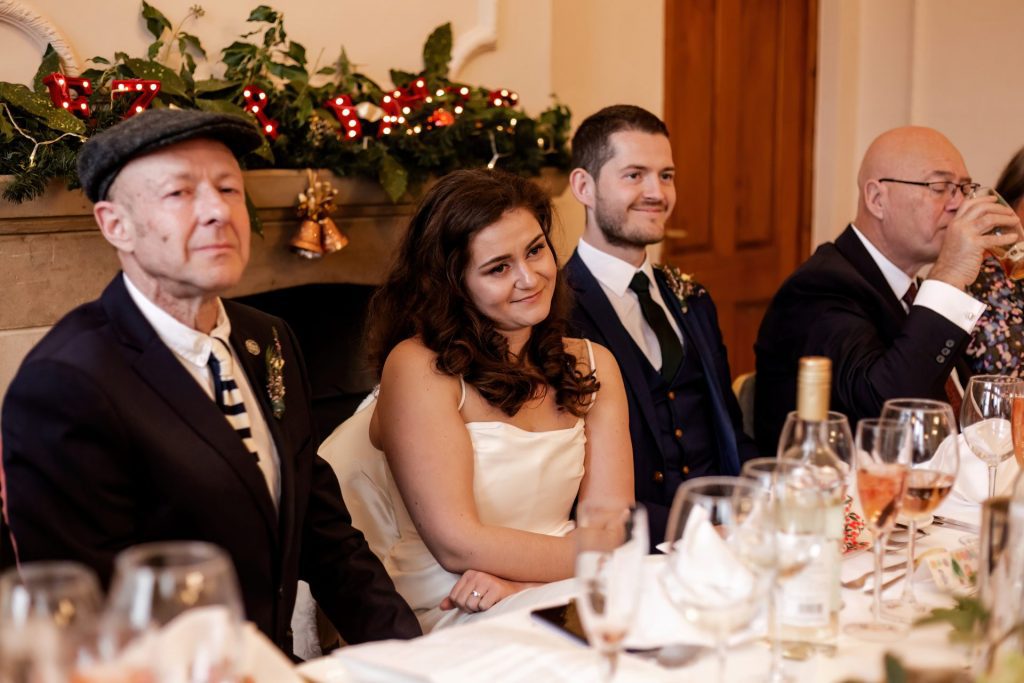Candid photo during the wedding speeches at the Monsall Head Pub. Photo in colour.