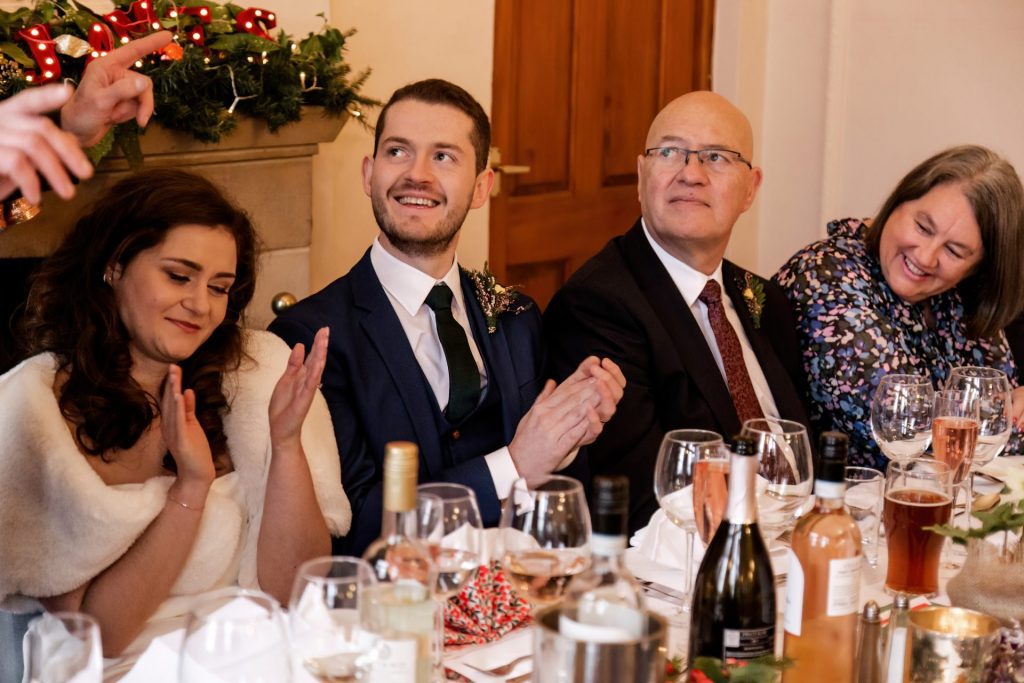 Candid photo during the wedding speeches at the Monsall Head Pub. Photo in colour.