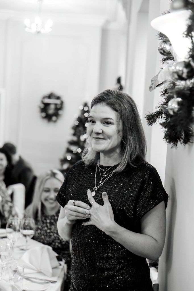 Candid photo during the wedding speeches at the Monsall Head Pub. Photo in black & white