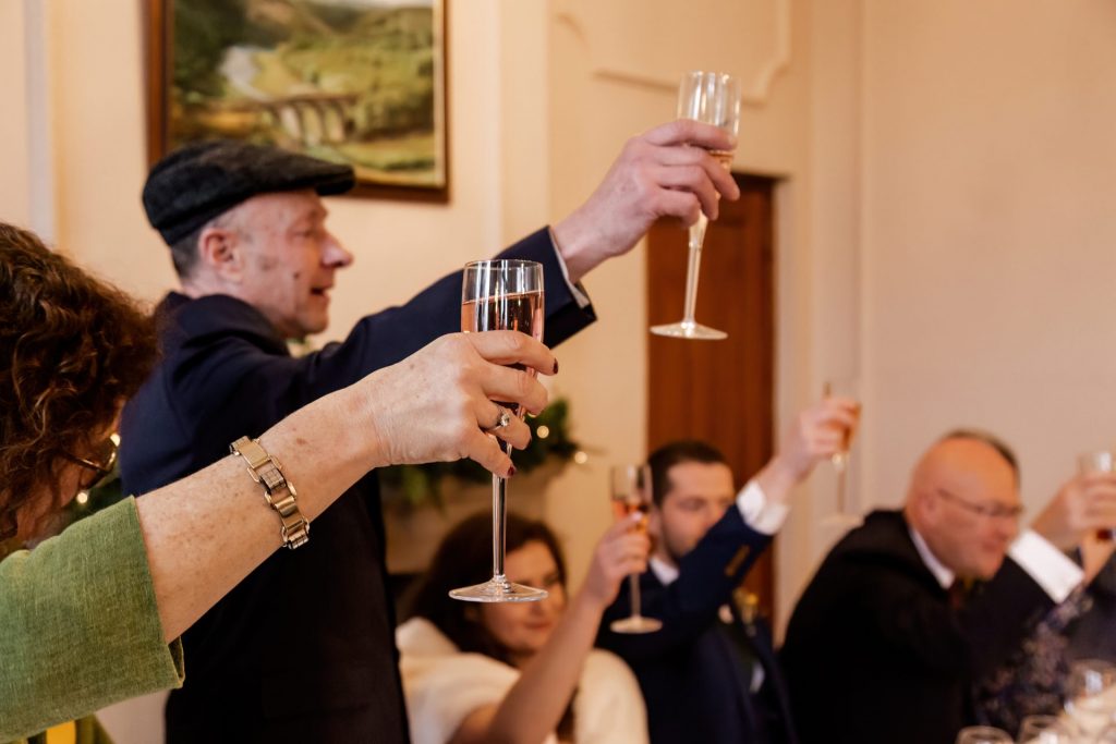 Candid photo during the wedding speeches at the Monsall Head Pub. Photo in colour.