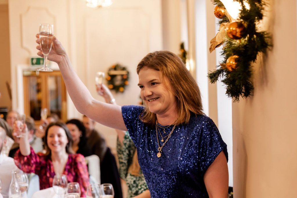 Candid photo during the wedding speeches at the Monsall Head Pub. Photo in colour.