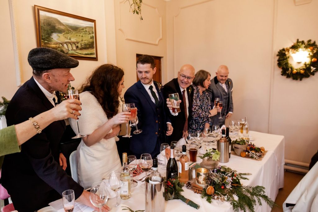 Candid photo during the wedding speeches at the Monsall Head Pub. Photo in colour.