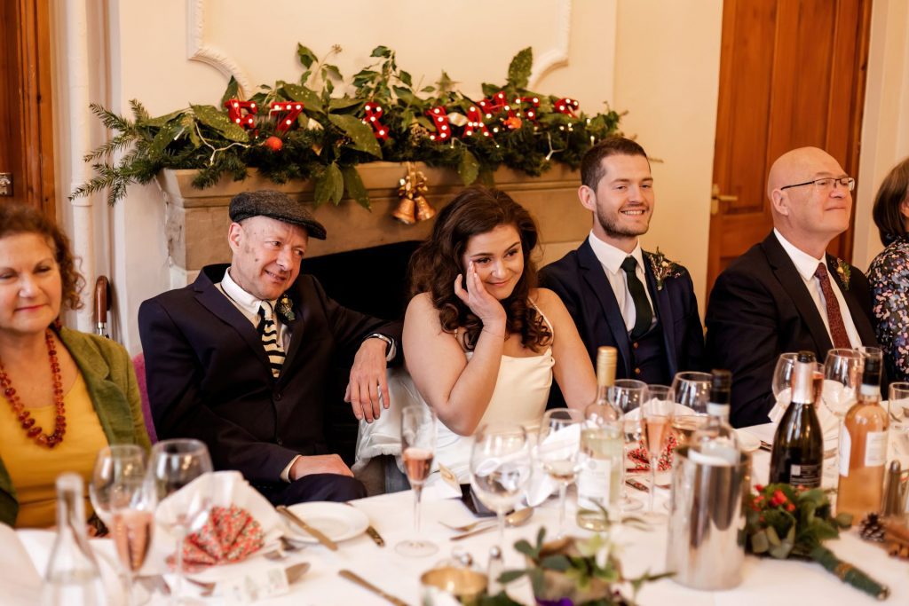 Candid photo during the wedding speeches at the Monsall Head Pub. Photo in colour.