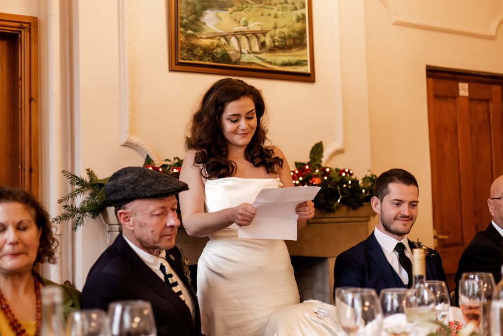 Candid photo during the wedding speeches at the Monsall Head Pub. Photo in colour.