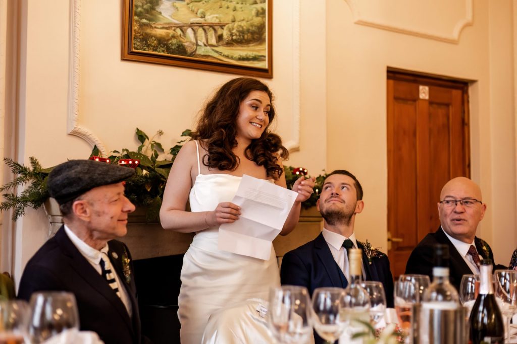 Candid photo during the wedding speeches at the Monsall Head Pub. Photo in colour.
