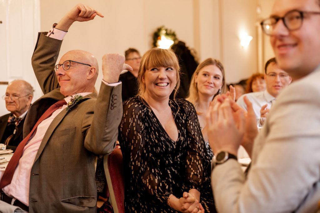 Candid photo during the wedding speeches at the Monsall Head Pub. Photo in colour.