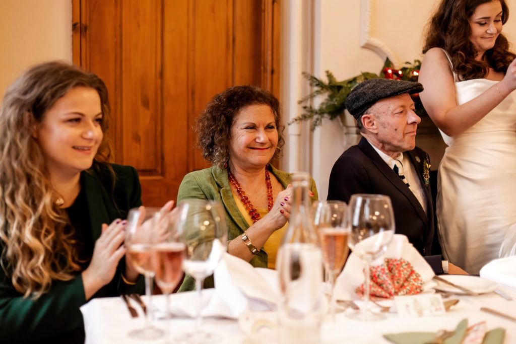 Candid photo during the wedding speeches at the Monsall Head Pub. Photo in colour.