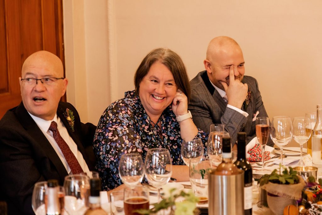 Candid photo during the wedding speeches at the Monsall Head Pub. Photo in colour.