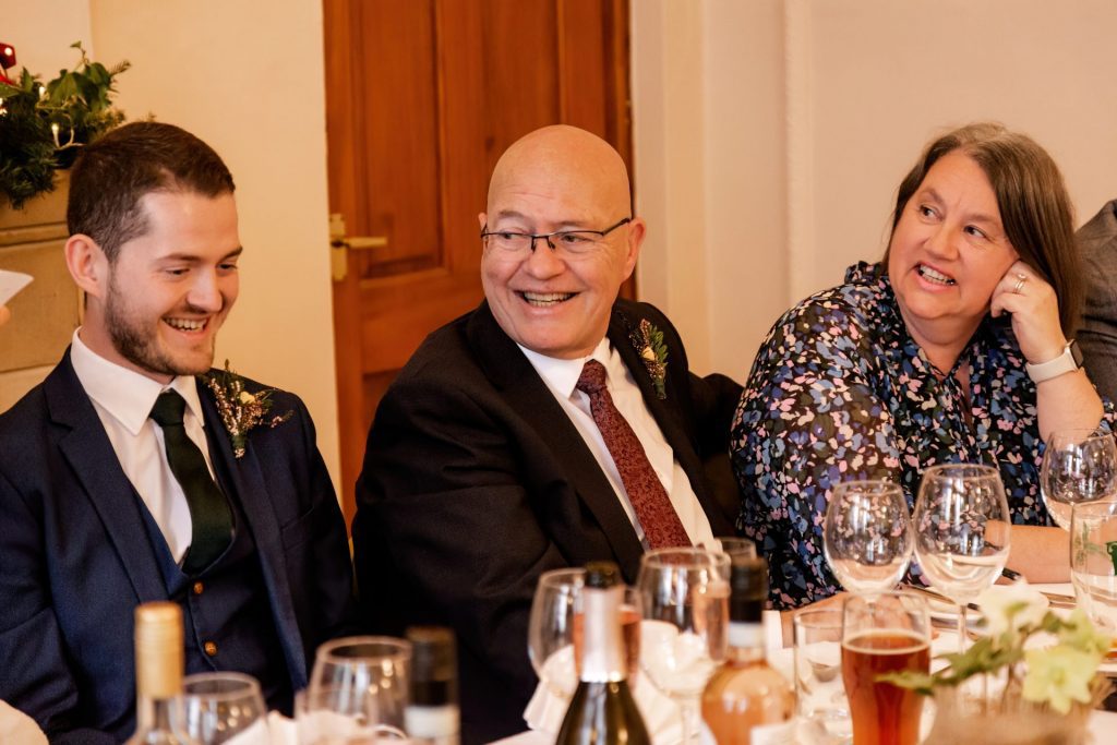 Candid photo during the wedding speeches at the Monsall Head Pub. Photo in colour.
