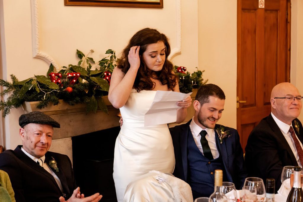 Candid photo during the wedding speeches at the Monsall Head Pub. Photo in colour.