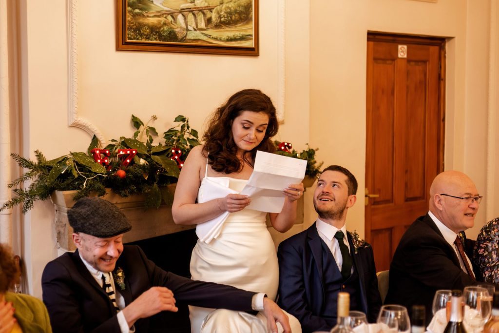 Candid photo during the wedding speeches at the Monsall Head Pub. Photo in colour.