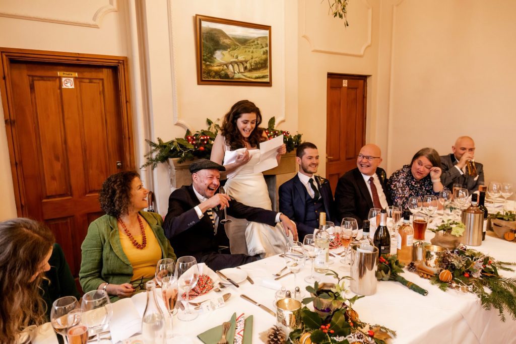 Candid photo during the wedding speeches at the Monsall Head Pub. Photo in colour.