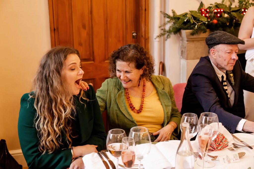 Candid photo during the wedding speeches at the Monsall Head Pub. Photo in colour.
