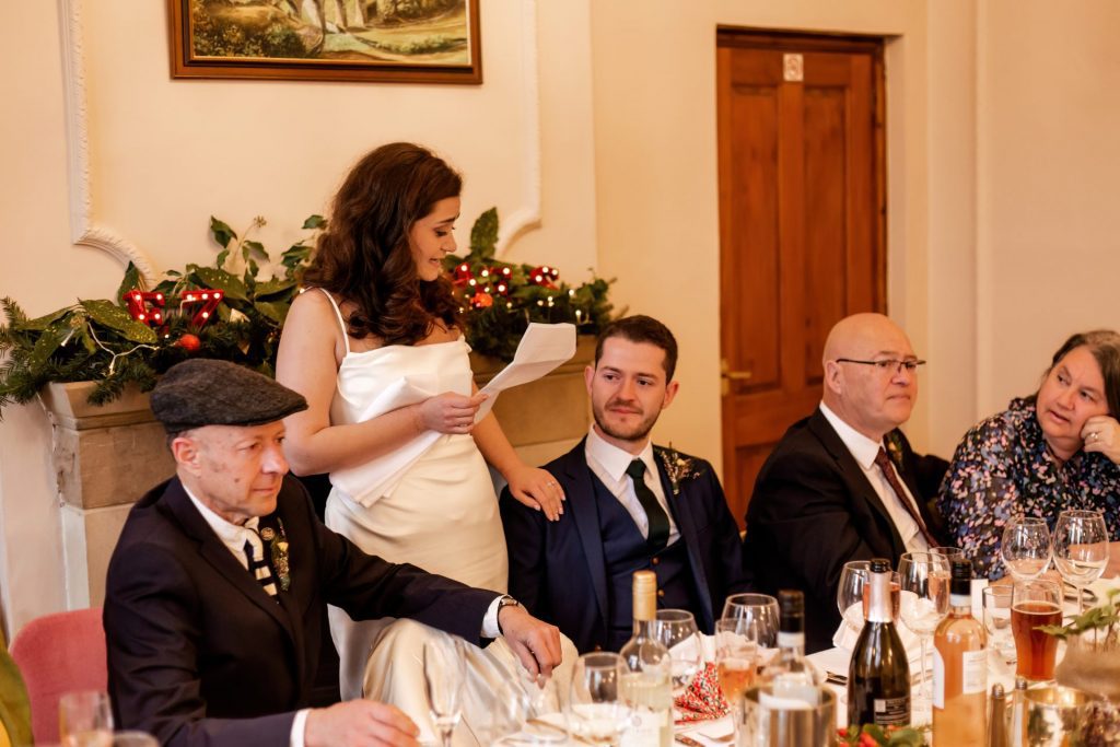 Candid photo during the wedding speeches at the Monsall Head Pub. Photo in colour.
