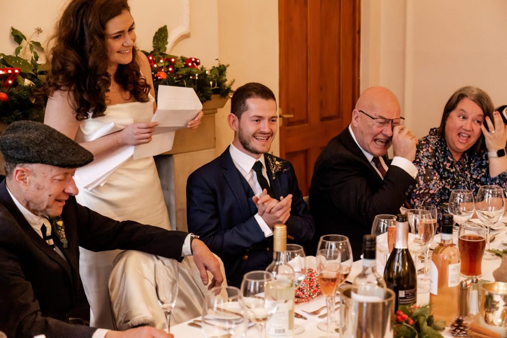 Candid photo during the wedding speeches at the Monsall Head Pub. Photo in colour.
