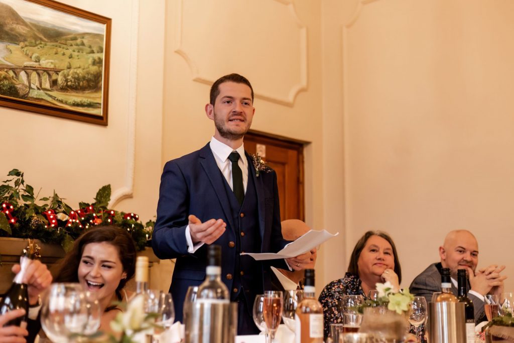 Candid photo during the wedding speeches at the Monsall Head Pub. Photo in colour.