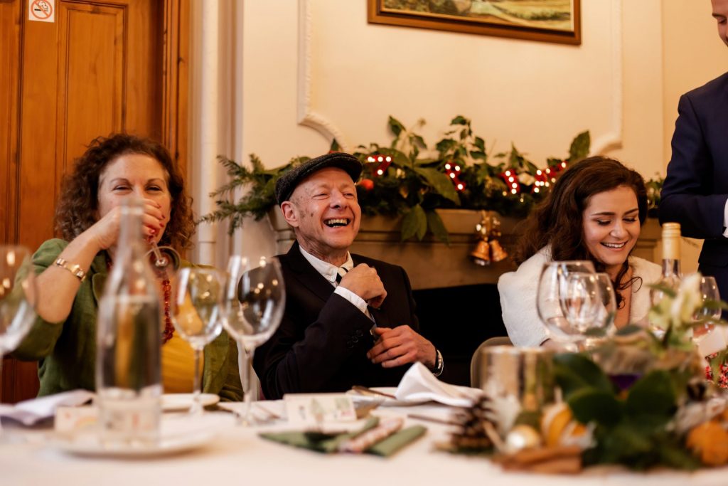 Candid photo during the wedding speeches at the Monsall Head Pub. Photo in colour.