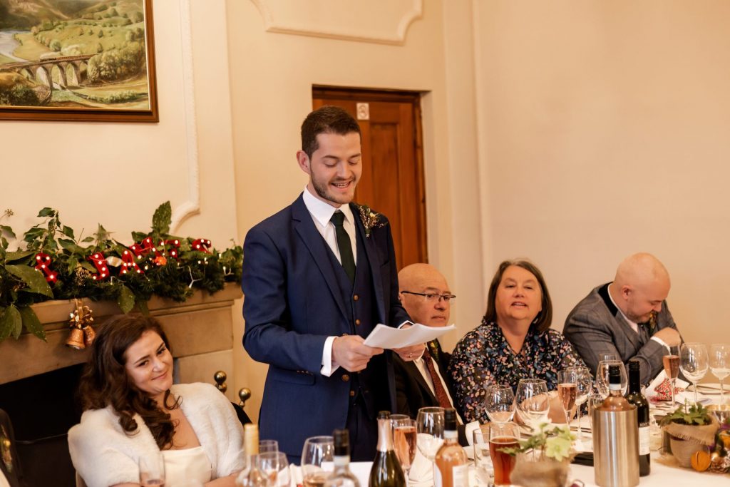 Candid photo during the wedding speeches at the Monsall Head Pub. Photo in colour.