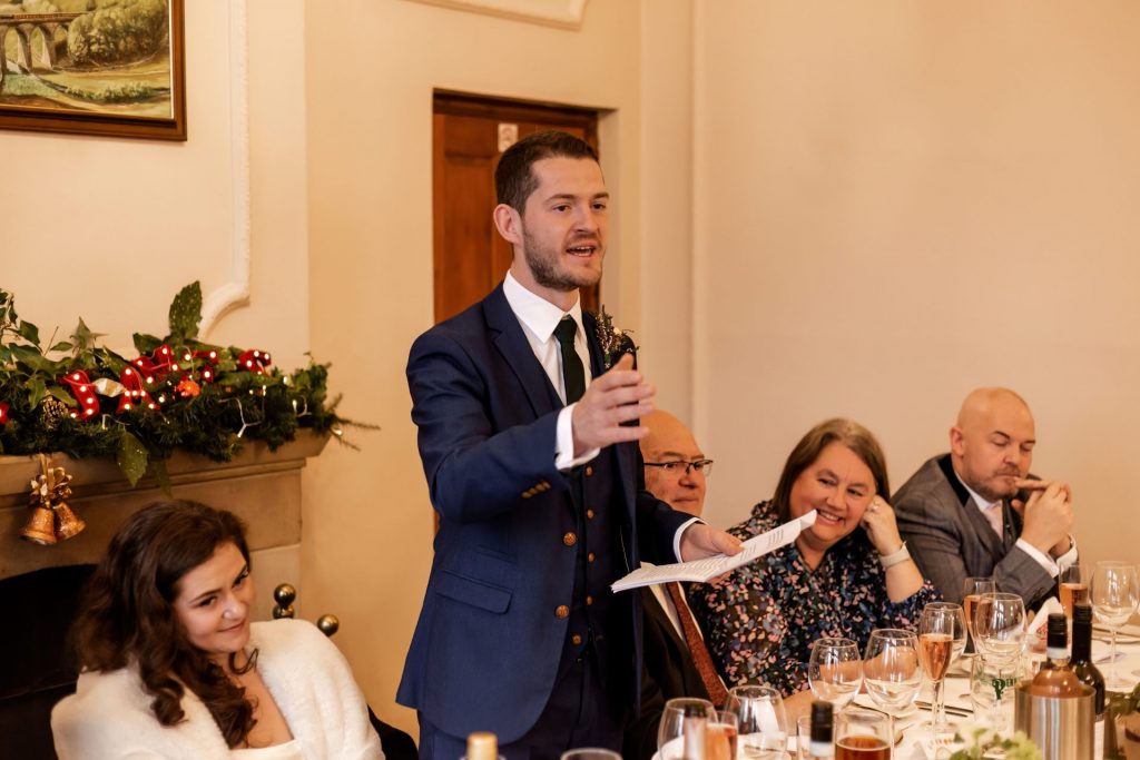 Candid photo during the wedding speeches at the Monsall Head Pub. Photo in colour.