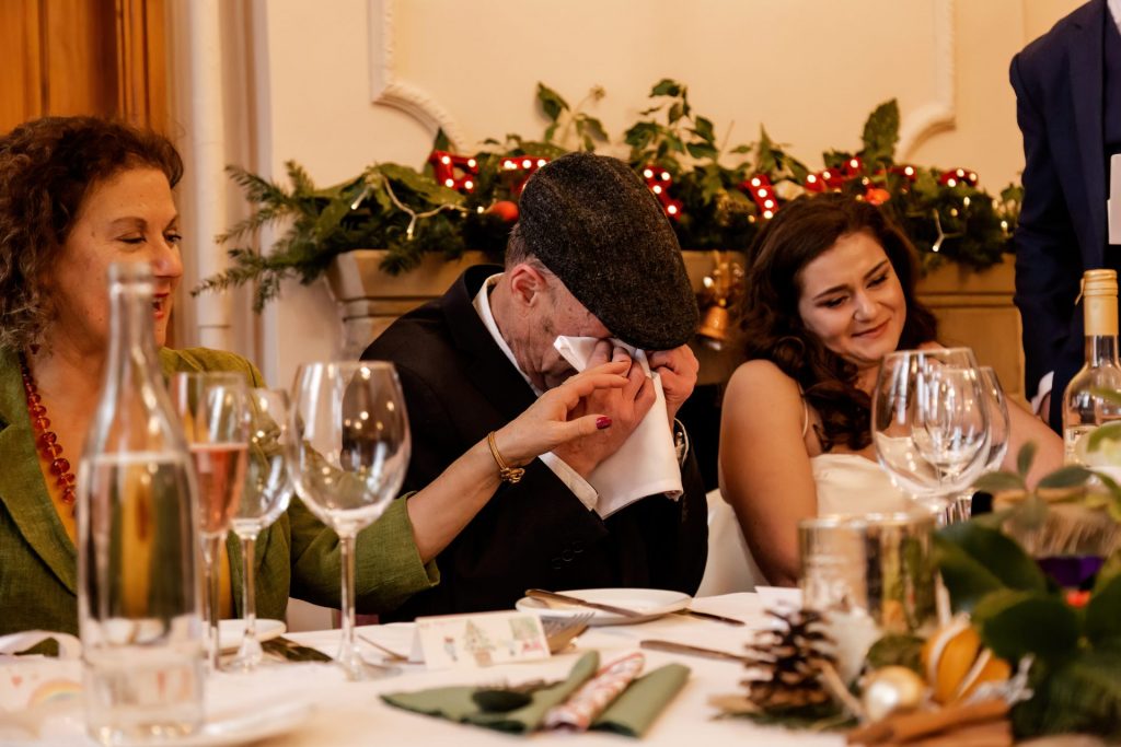Candid photo during the wedding speeches at the Monsall Head Pub. Photo in colour.