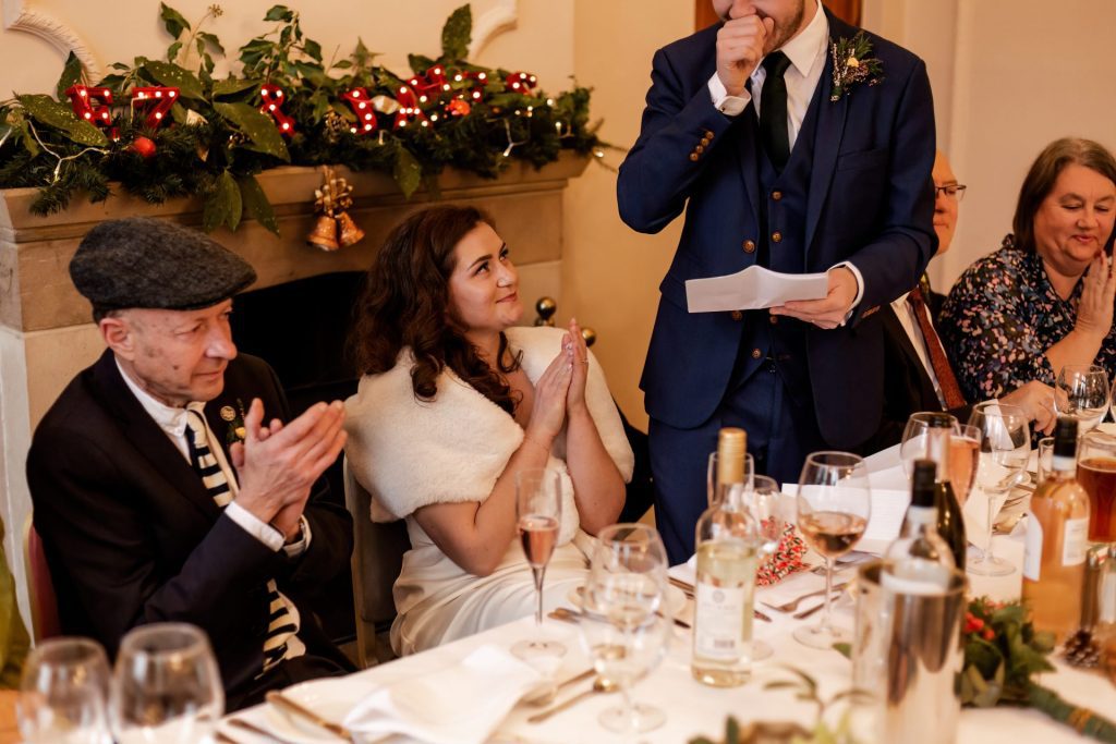Candid photo during the wedding speeches at the Monsall Head Pub. Photo in colour.
