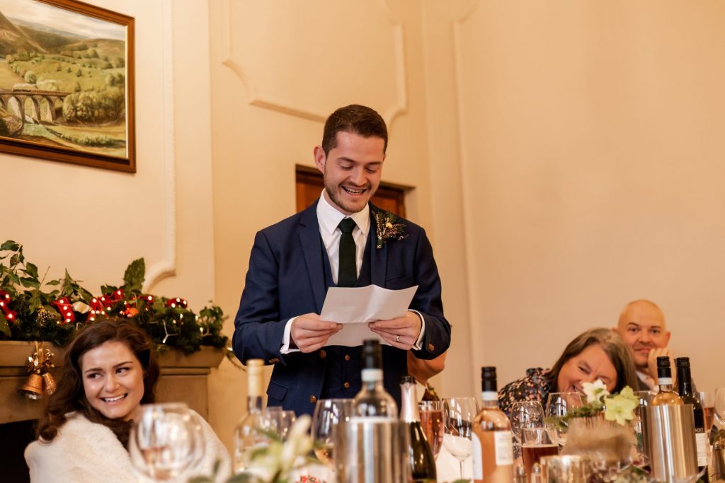 Candid photo during the wedding speeches at the Monsall Head Pub. Photo in colour.