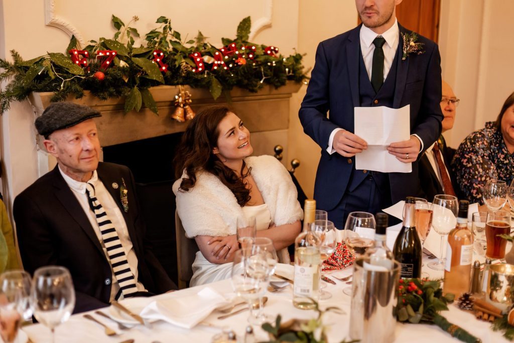 Candid photo during the wedding speeches at the Monsall Head Pub. Photo in colour.