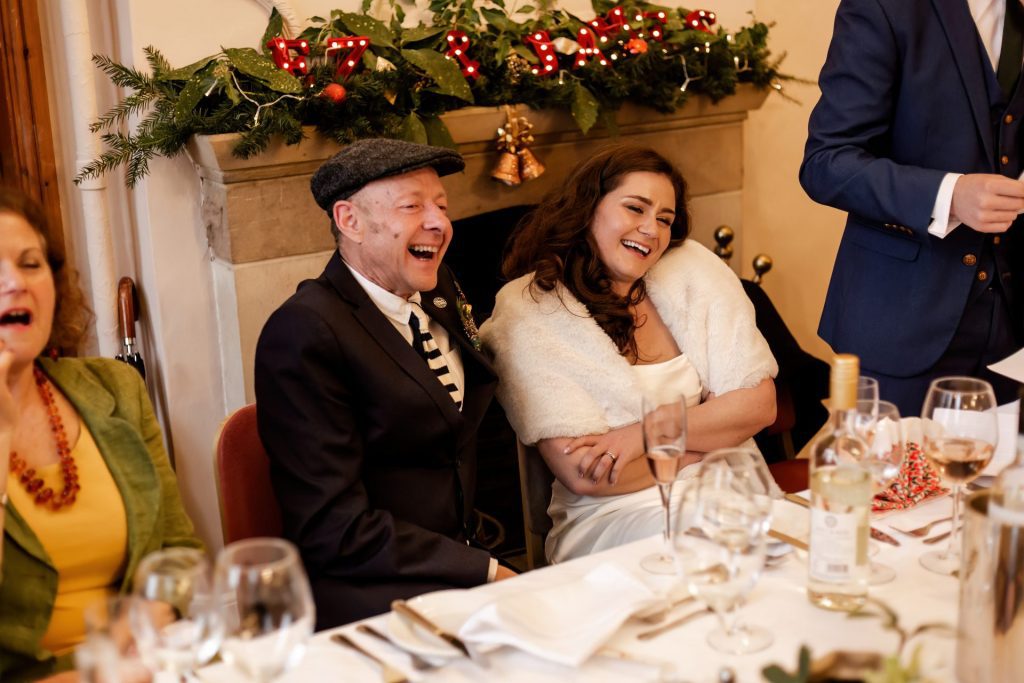 Candid photo during the wedding speeches at the Monsall Head Pub. Photo in colour.