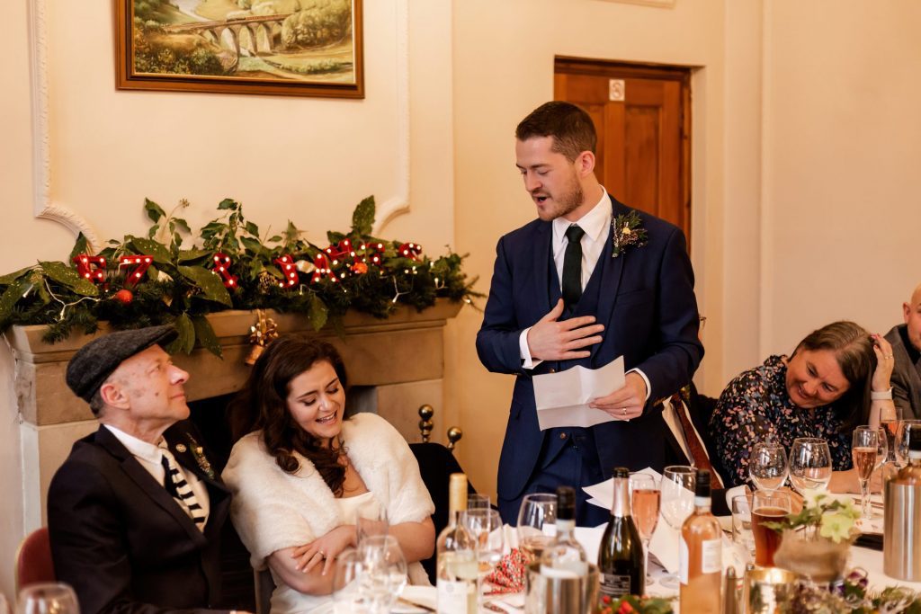 Candid photo during the wedding speeches at the Monsall Head Pub. Photo in colour.