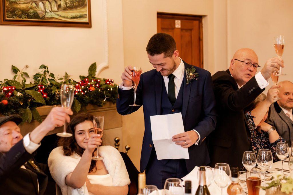 Candid photo during the wedding speeches at the Monsall Head Pub. Photo in colour.