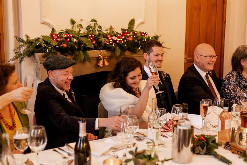 Candid photo during the wedding speeches at the Monsall Head Pub. Photo in colour.