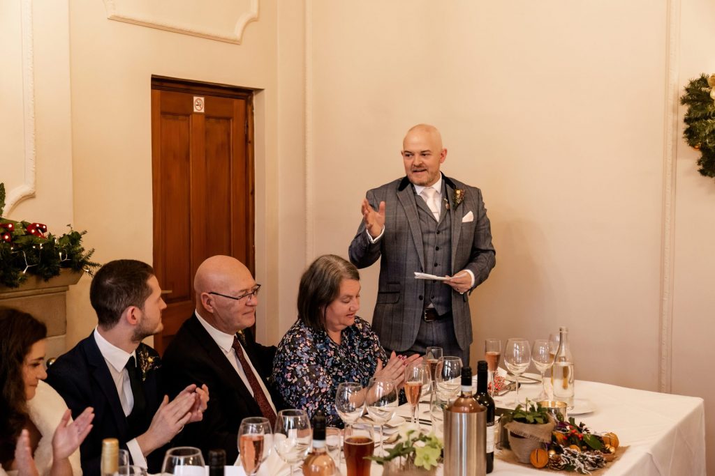 Candid photo during the wedding speeches at the Monsall Head Pub. Photo in colour.