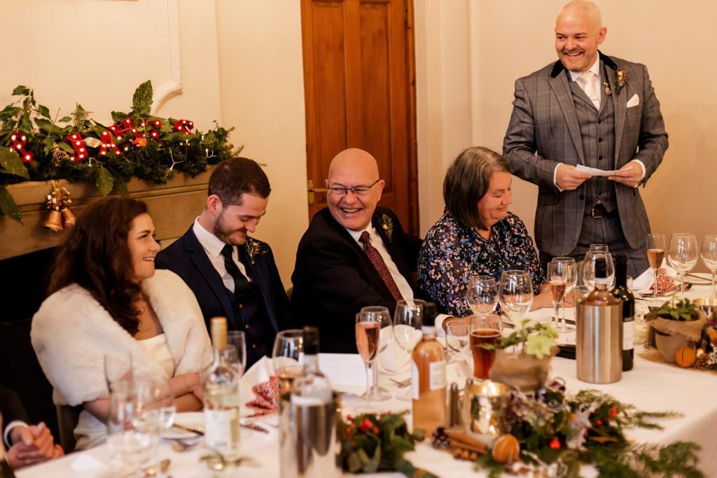 Candid photo during the wedding speeches at the Monsall Head Pub. Photo in colour.