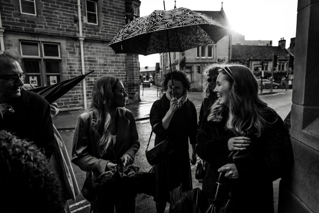 Candid Photo of wedding party before the wedding ceremony. Photo in black & white