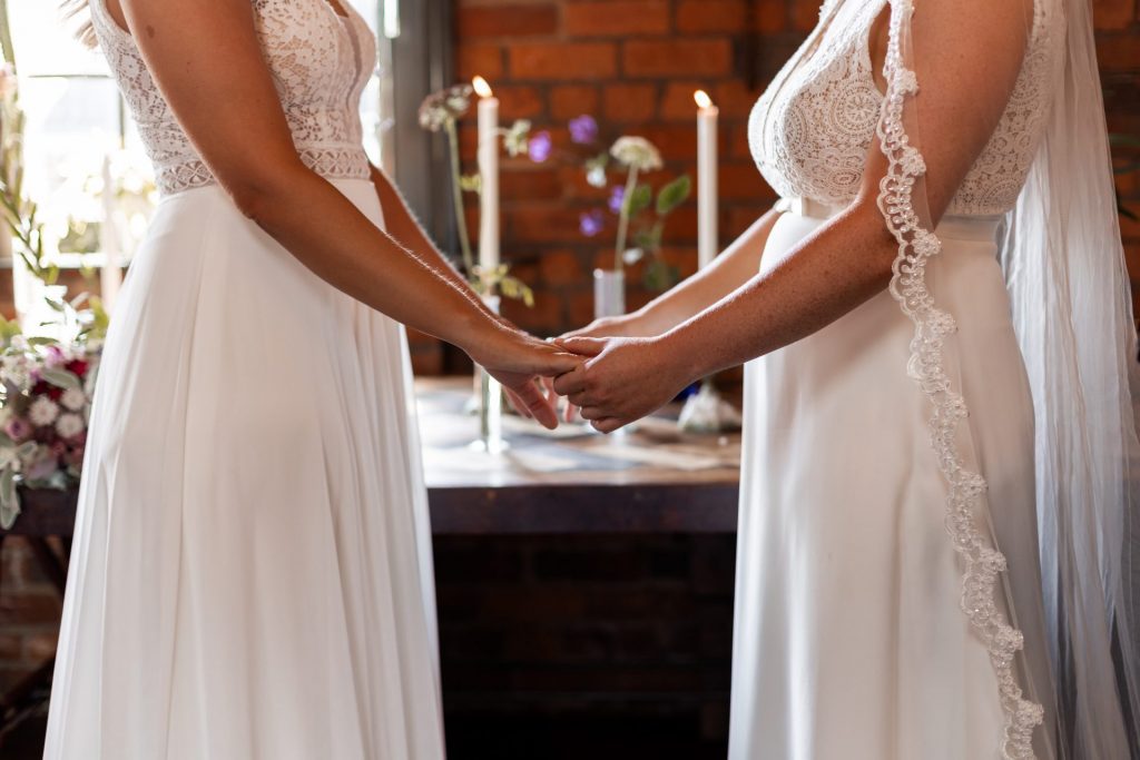 Close in shot of the bride & bride wedding ceremony at The Chimney House wedding venue, Kelham Island, Sheffield. Isabelle B Photography