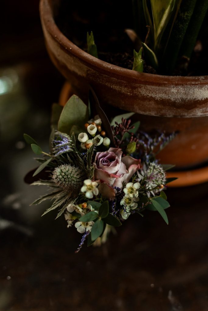 Detail shot of the button hole flowers at The Chimney House wedding venue, Kelham Island, Sheffield. Isabelle B Photography