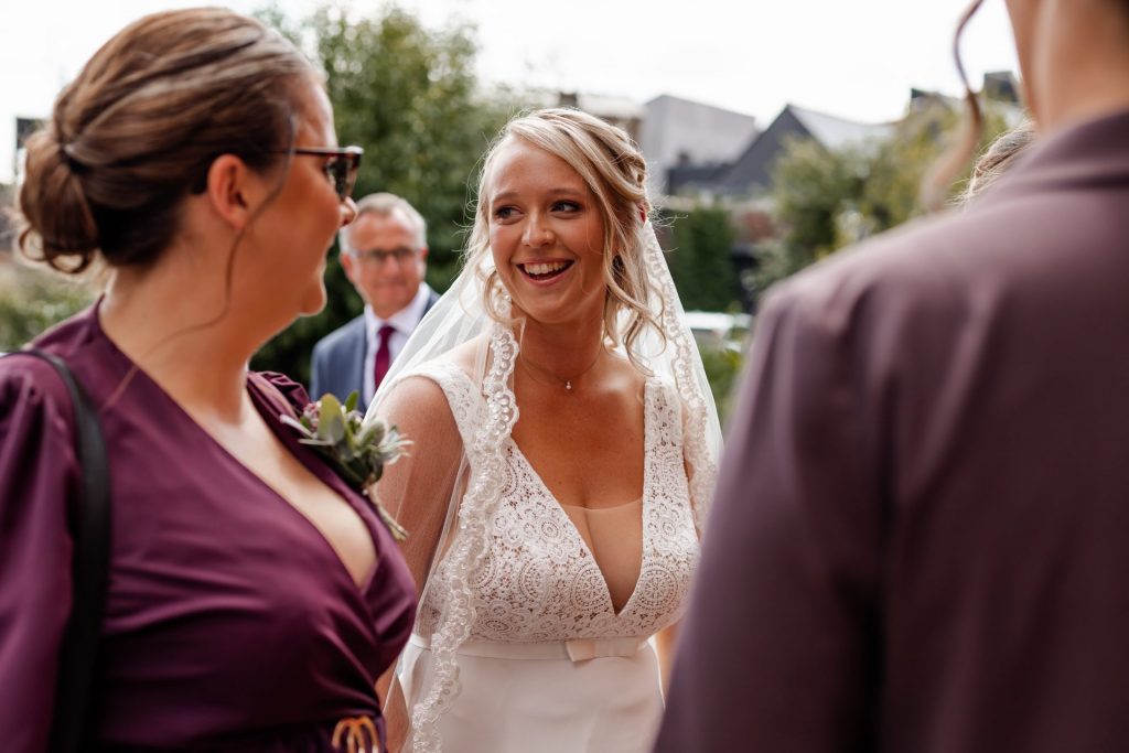 Candid shot of the bride arriving at The Chimney House wedding venue, Kelham Island, Sheffield. Isabelle B Photography