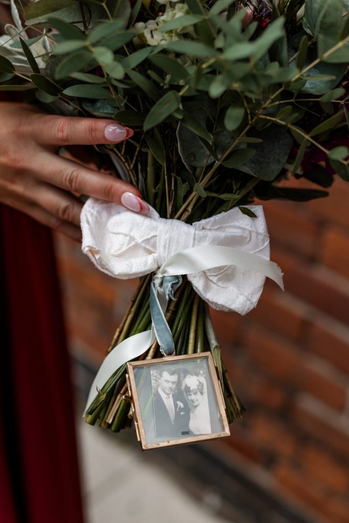 Detailed shot of the grandparents photo attached to the bridal bouquet at The Chimney House wedding venue, Kelham Island, Sheffield. Isabelle B Photography