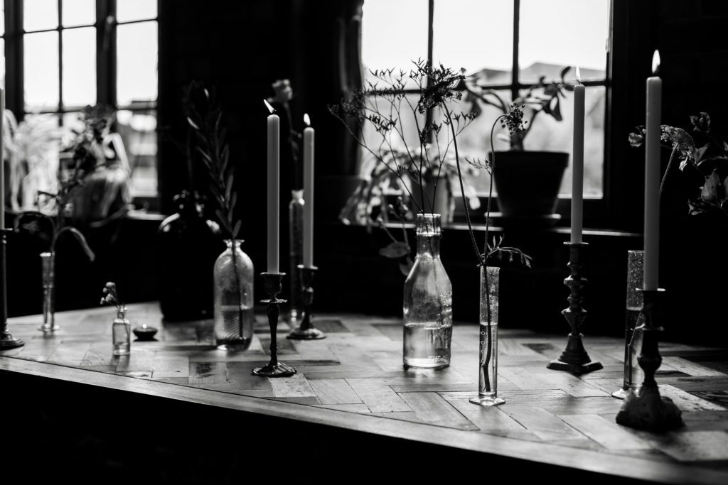 Detail shot of the candles & flowers at The Chimney House wedding venue, Kelham Island, Sheffield. Isabelle B Photography - Black & White