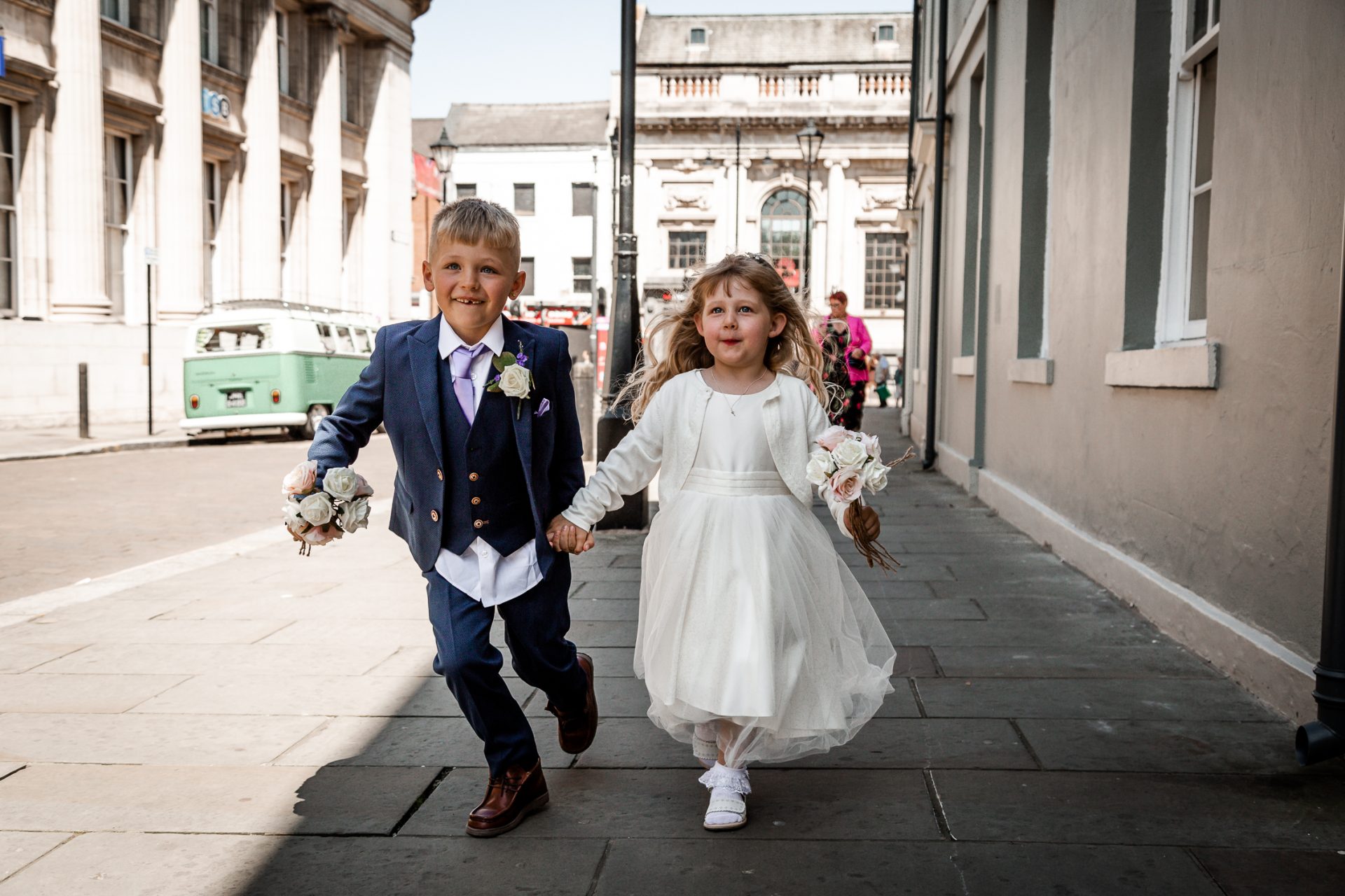 Paige boy and flower girl running toward the venue. Isabelle B Photography, Sheffield Wedding Photography