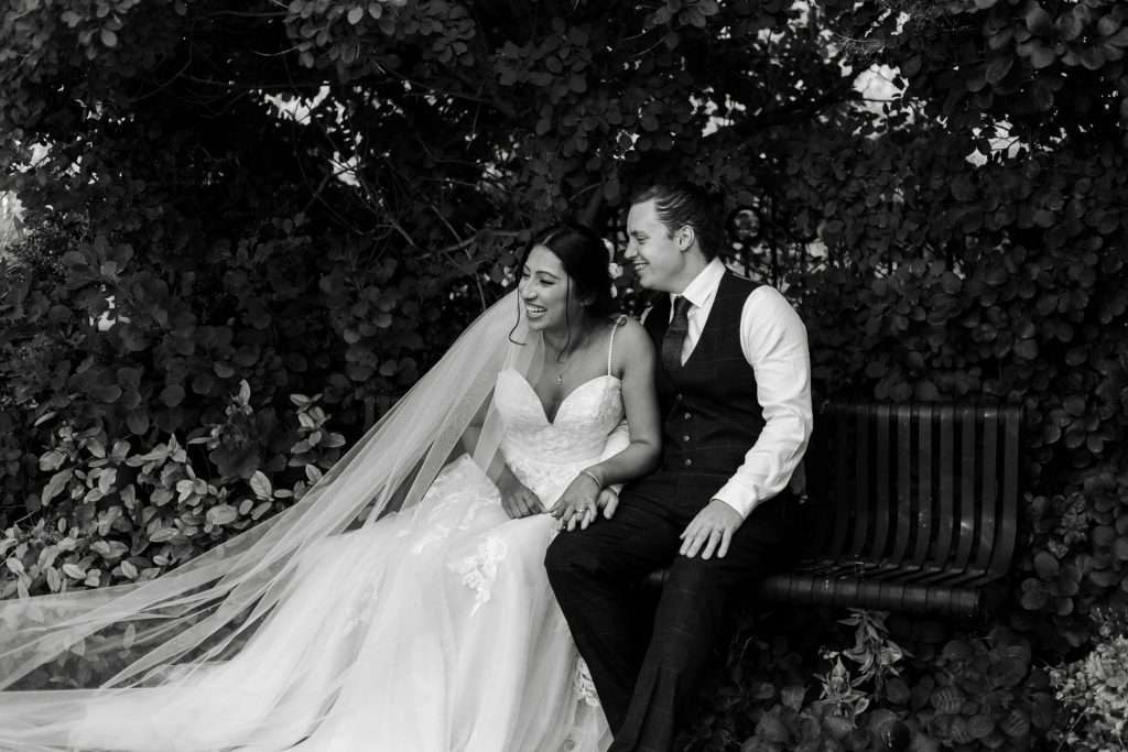 Shot of the bride & groom sat together outside The Crown Plaza, Sheffield. Isabelle B Photography 