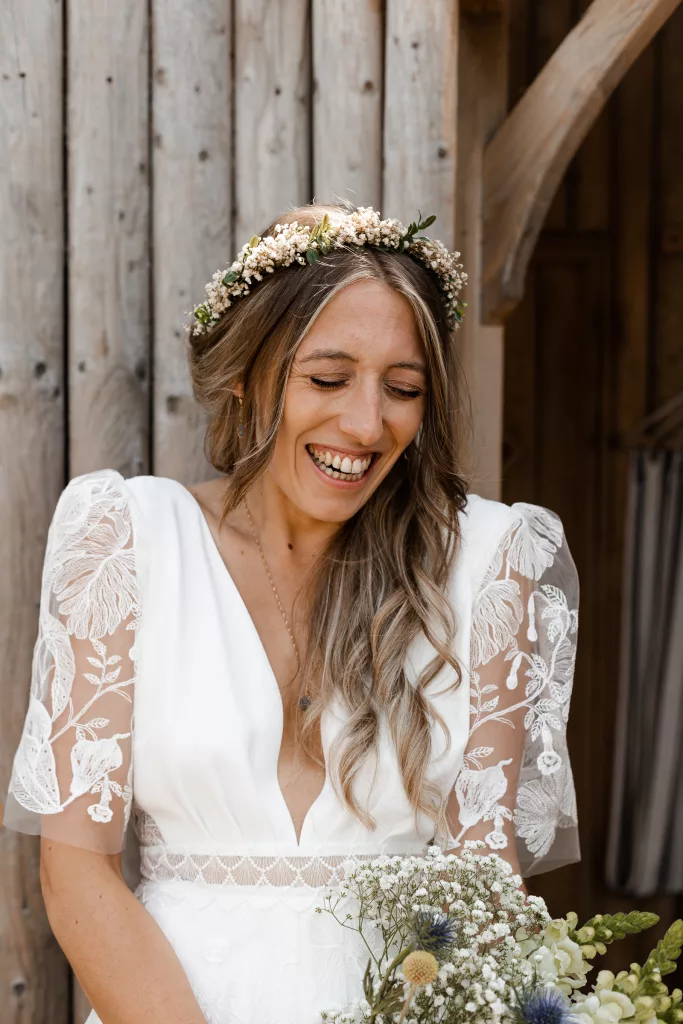 Close up of the Bride before her wedding ceremony at Harvest Moon wedding venue in Scotland. The bride is wearing a rembo styles wedding dress and flower crown